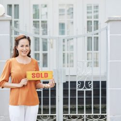 Portrait of pretty mature Asian woman sold her house